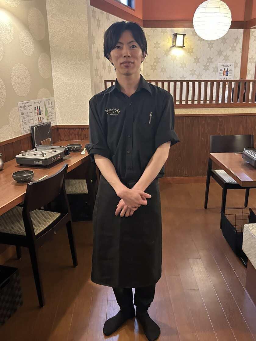 牛もつどて鍋 まつい亭の制服1